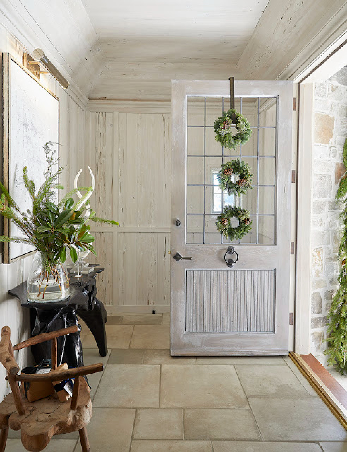 Jeffrey Dungan and Beth Webb designed entry with pale stained natural rustic woods and sophisticated yet laid back decor.