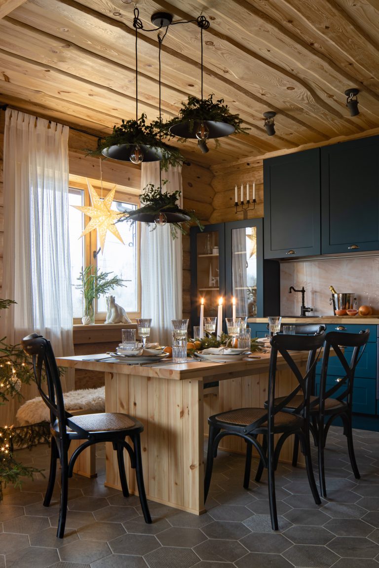 Christmas decor in a European kitchen with modern rustic blue cabinets - Ekaterina Pozdeev.