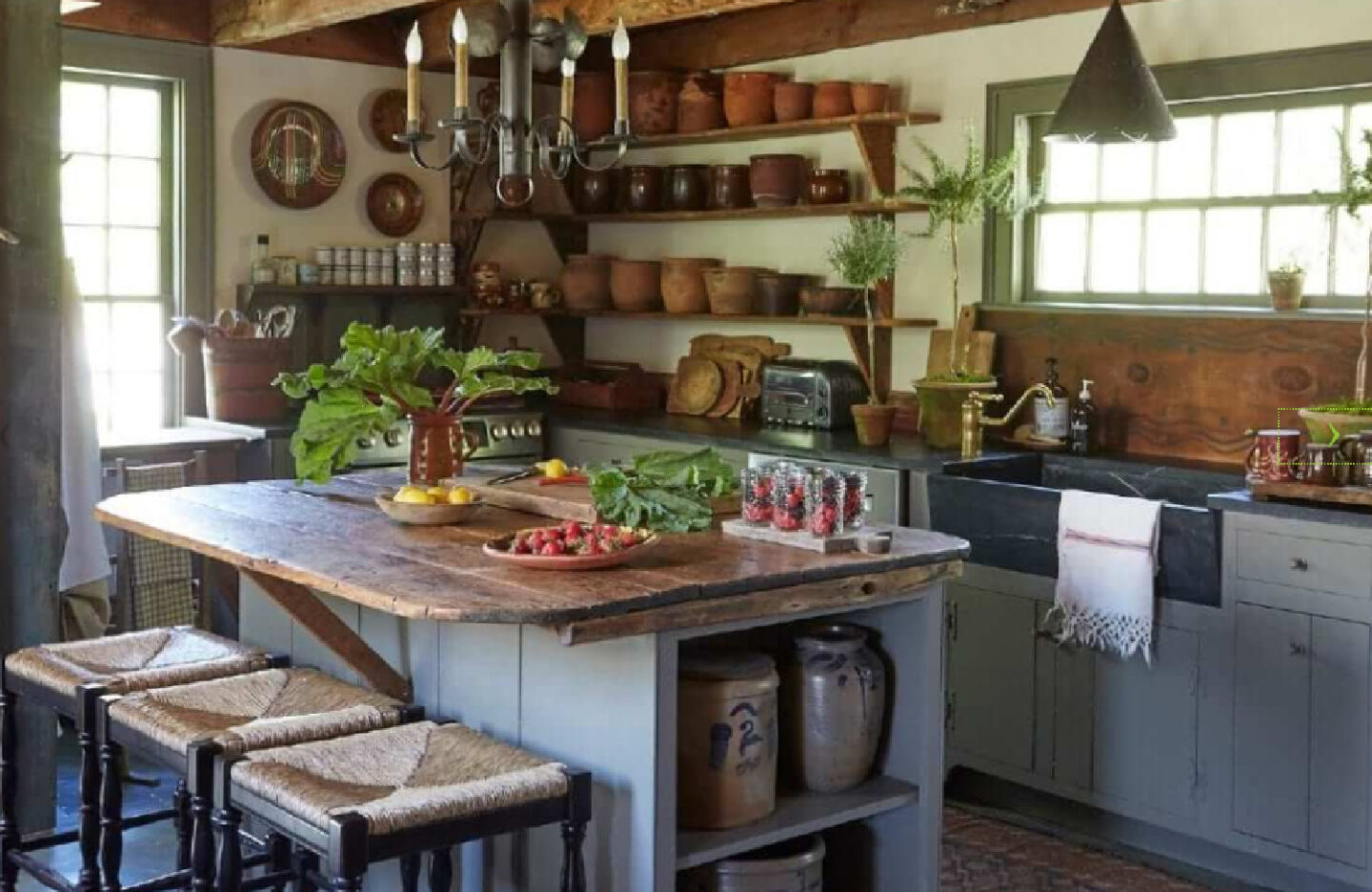 A glorious rustic country kitchen with open shelves and chandelier - from Nora Murphy's Country House book.