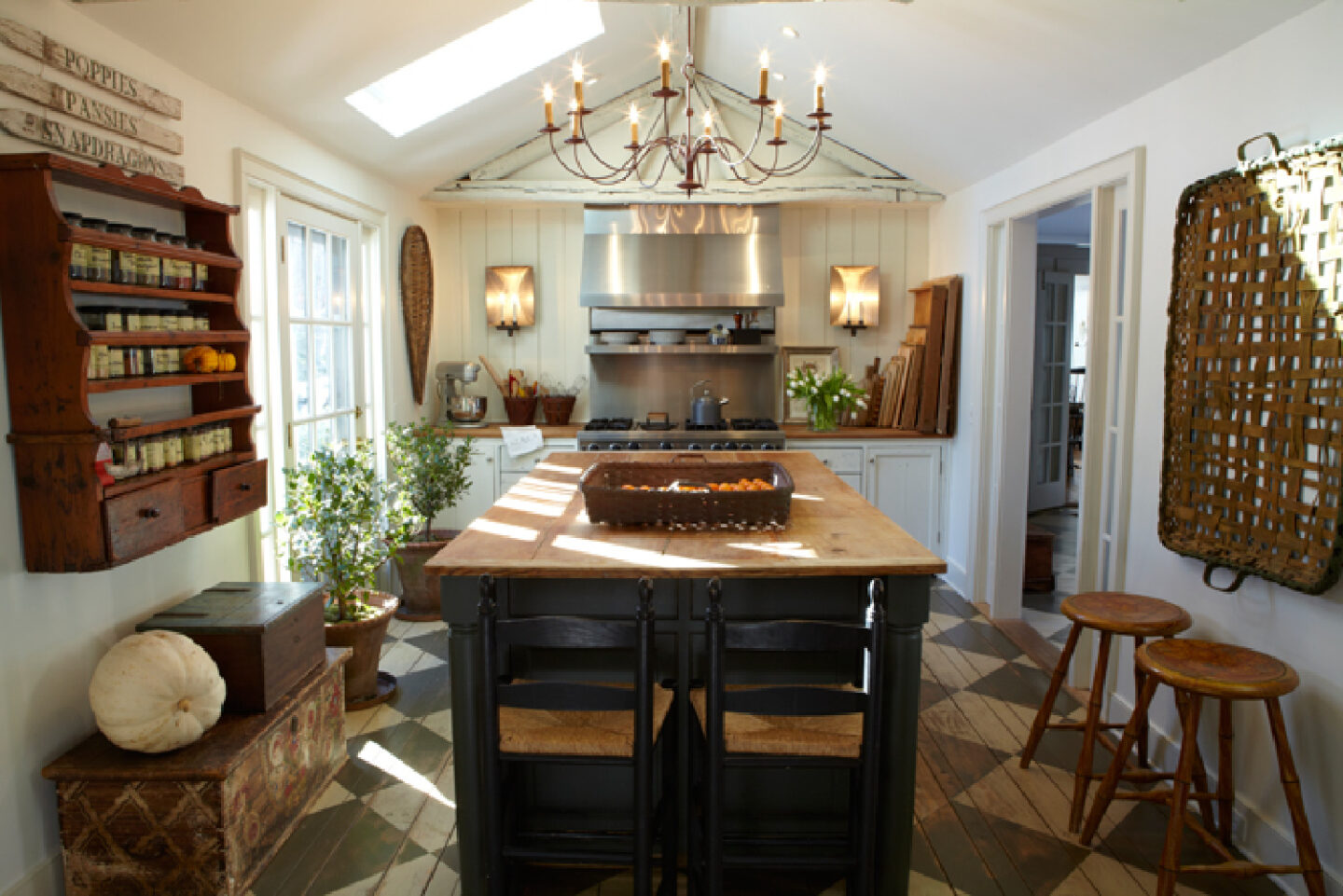 Nora Murphy's charming country kitchen in her Connecticut farmhouse with checkered floors and primitives. #noramurphy #countrykitchen #checkeredfloor