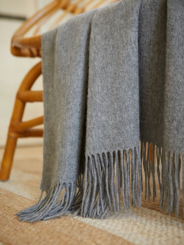 Gorgeous heather gray cashmere throw with fringe from looks fabulous and stylish anywhere you toss it. #cashmerethrow #graythrow #cashmere