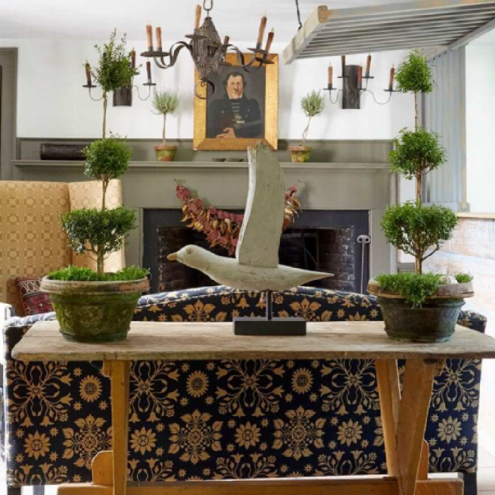 American country style living room with antiques and folk printed upholstery on sofa - Nora Murphy.