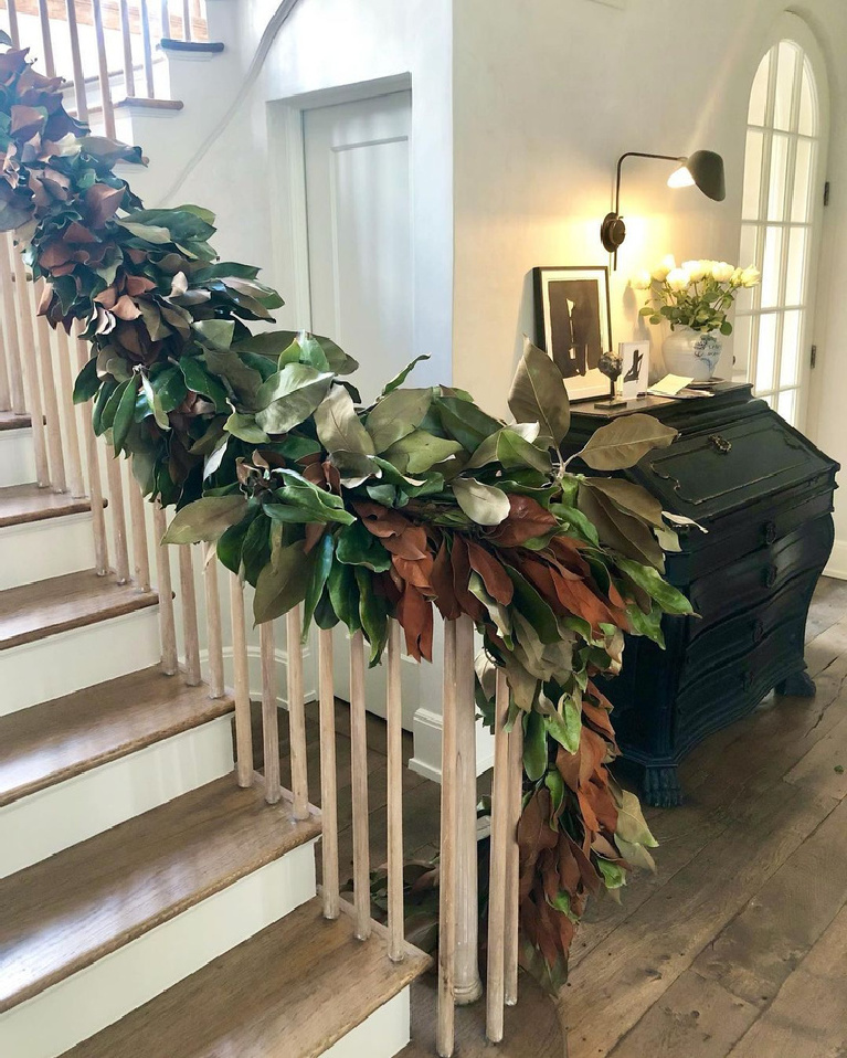 Elegant Christmas decorated staircase with magnolia garland in Pamela Pierce's Houston home - Milieu magazine.