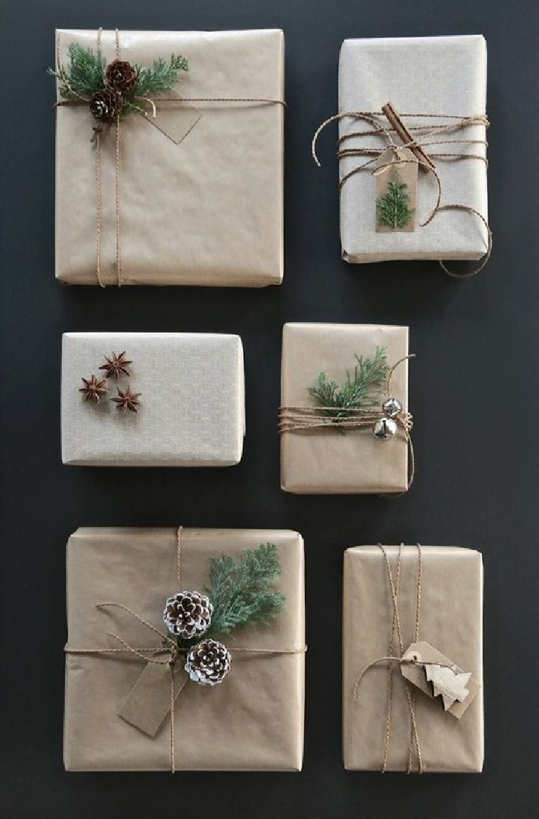 Simple Christmas giftwrap idea with brown kraft paper, twine, pinecones, and simple embellishments for a Scandinavian holiday feel - Freshideen.