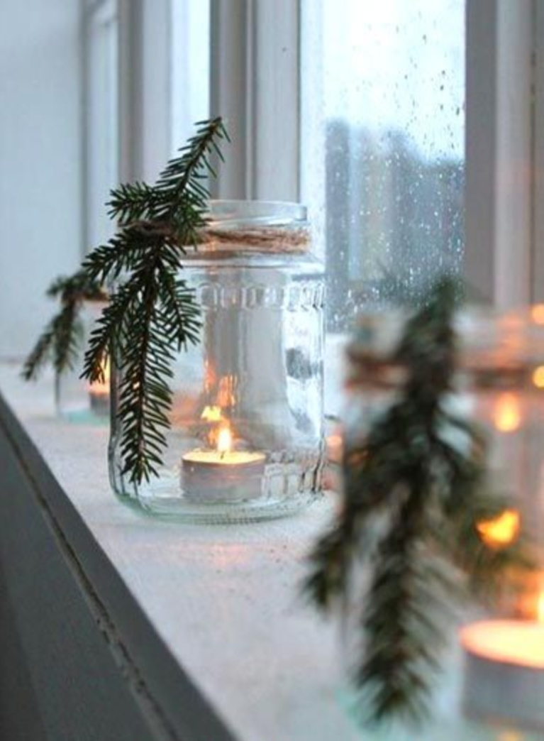 Simple yet lovely Scandi Christmas decor idea with glass jar, greenery, twine, and votive candle in window - Zolushka-new.