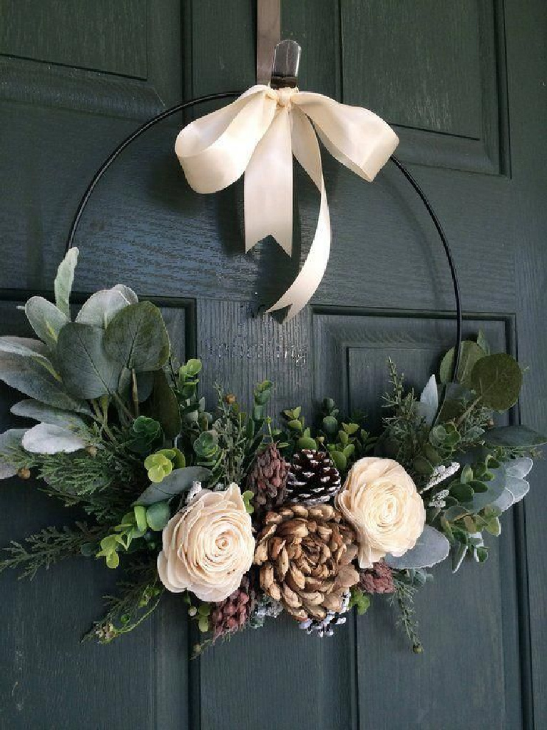 Gorgeous winter wreath on a teal door - roses, pinecones and eucalyptus combine for a striking Scandinavian style Christmas vibe - Truloveblooms on etsy.