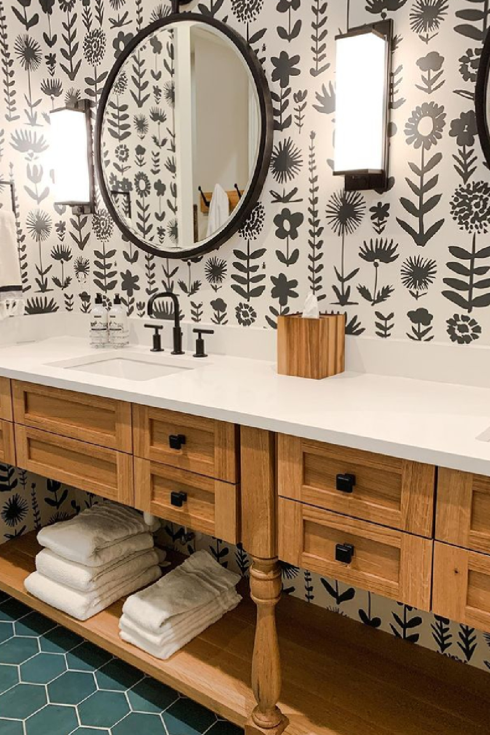 Schumacher Wild Things Wallpaper in black in Sherry Hart designed bathroom with wood vanity and green hex tiled floor. #schumacherwildthings #wallpaperedbathroom