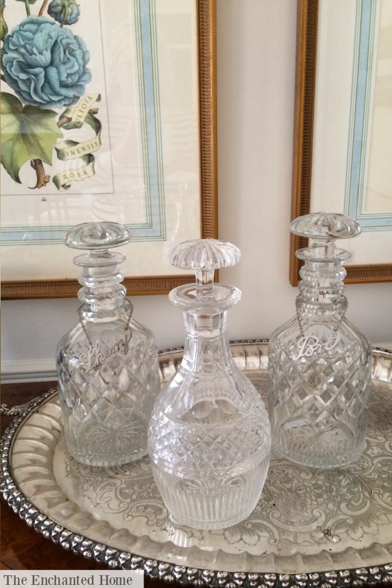 Pretty vintage glass decanters on a silver tray impart Grandmillennial decor style in this traditional vignette - The Enchanted Home. #grandmillennial #interiordesign #newtraditionalists