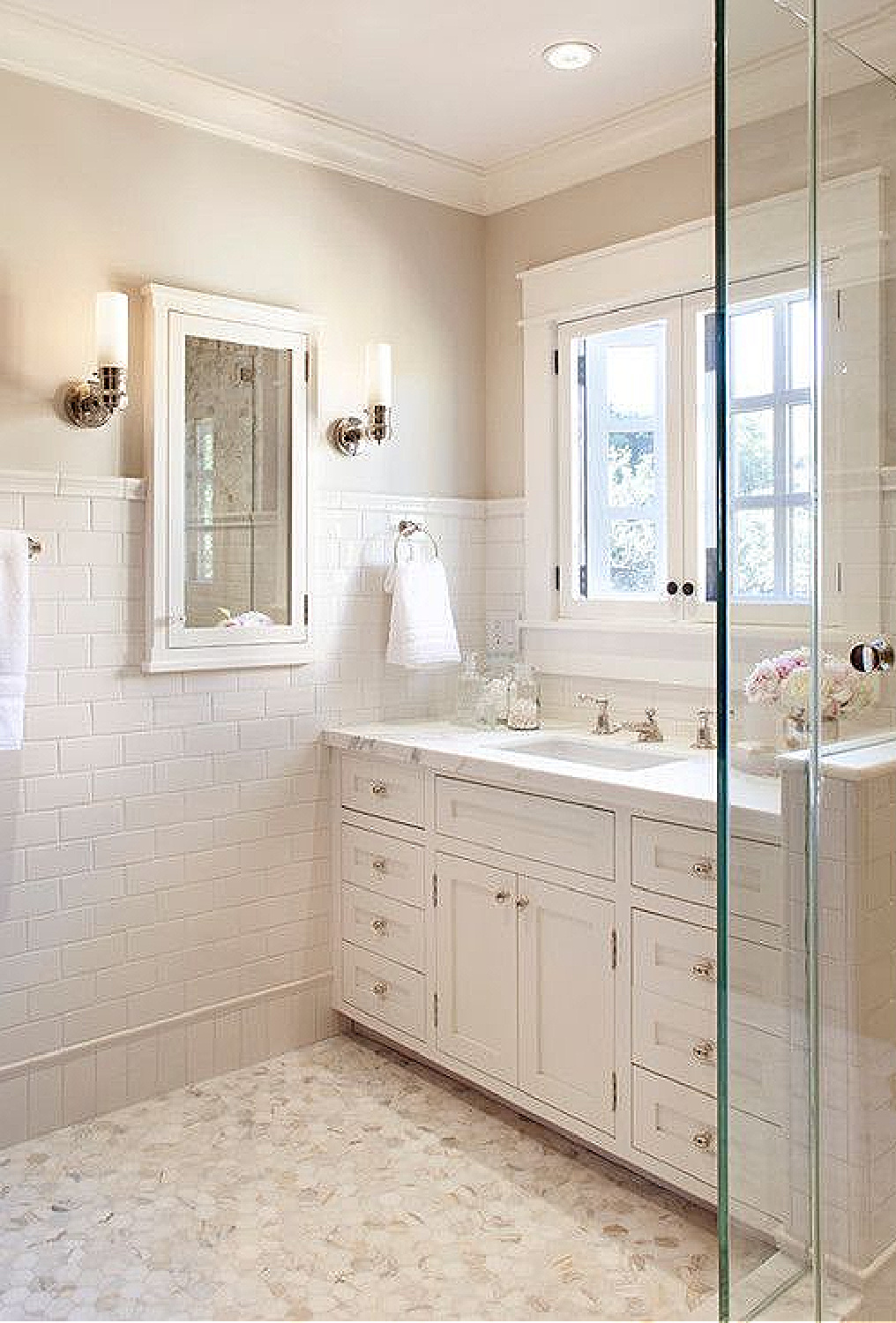 Warm creamy white bathroom painted Atrium White (Benjamin Moore). #paintcolors #whitepaintcolors #atriumwhite