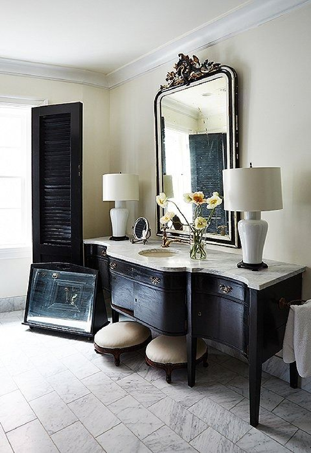 Bath with black vanity in a gorgeous bath by designer  Darryl Carter. Try SW Tricorn Black for a similar look. #blackbath.