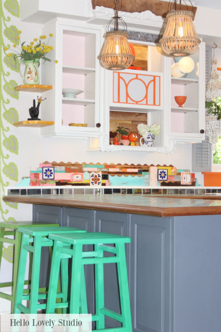 A colorful kitchen designed with vintage thrifted finds reflects Grandmillennial style and personality plus - Jenny Sweeney designed kitchen on Hello Lovely. #grandmillennial #kitchens