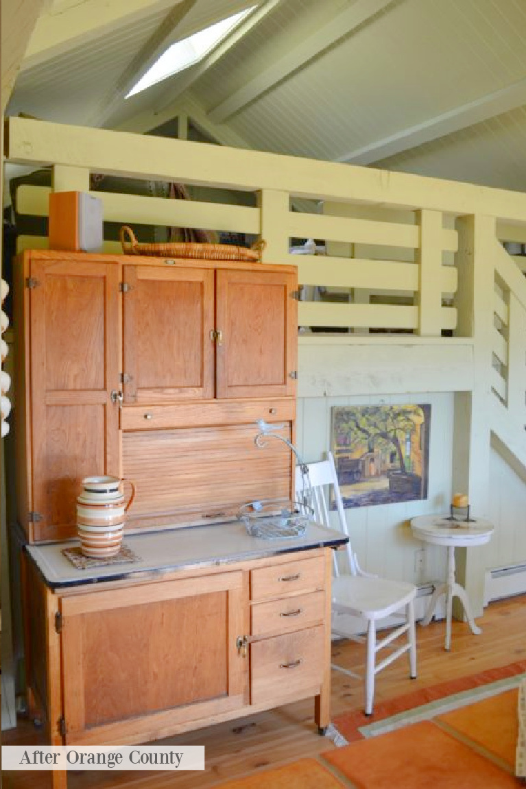 Hoosier cabinet and vintage green tones in a cozy cottage reflecting Grandmillennial style - After Orange County.
