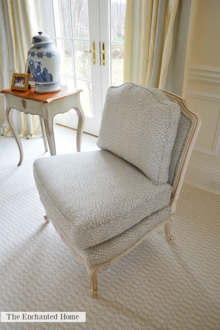 Charming light blue and white slipper chair in a traditional bedroom with Grandmillennial style - The Enchanted Home.