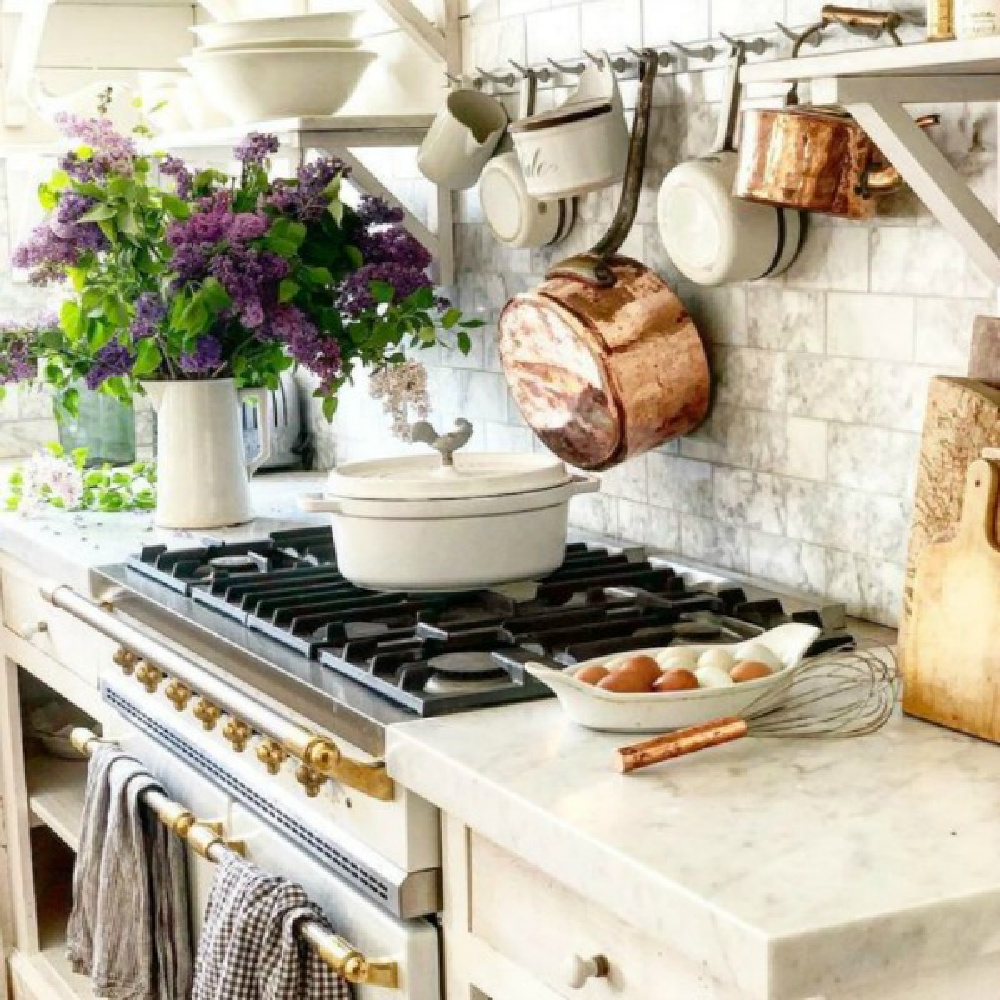French farmhouse kitchen with French range, marble subway backsplash, and copper pots - Dreamywhites Atelier.