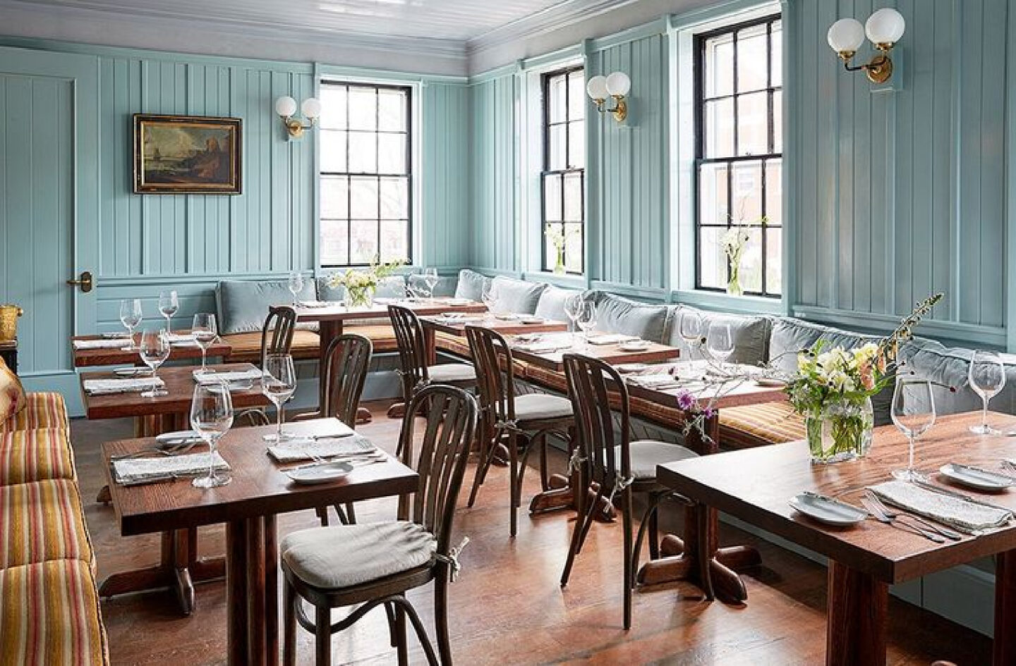 The dining room’s sea-blue walls lend it a modern New England tavern feel. The menu from executive chef Marcus Gleadow-Ware, an alum of Charlie Palmer’s Michelin-starred Aureole, reflects the same sensibility, incorporating local organic produce from landscape designer Marty McGowan’s Pumpkin Pond Farm.