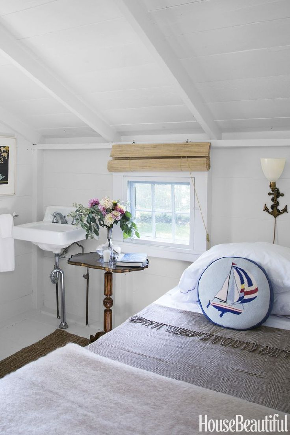 Charming white cottage style bedroom in a Nantucket cottage. COME TOUR MORE Nantucket Style Chic & Summer Vibes! #nantucket #interiordesign #designinspiration #summerliving #coastalstyle