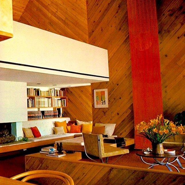 Funky 1980s family room with lofty ceiling, wood paneling installed on diagonal, and earth tones - @jenniferthenc_realtor