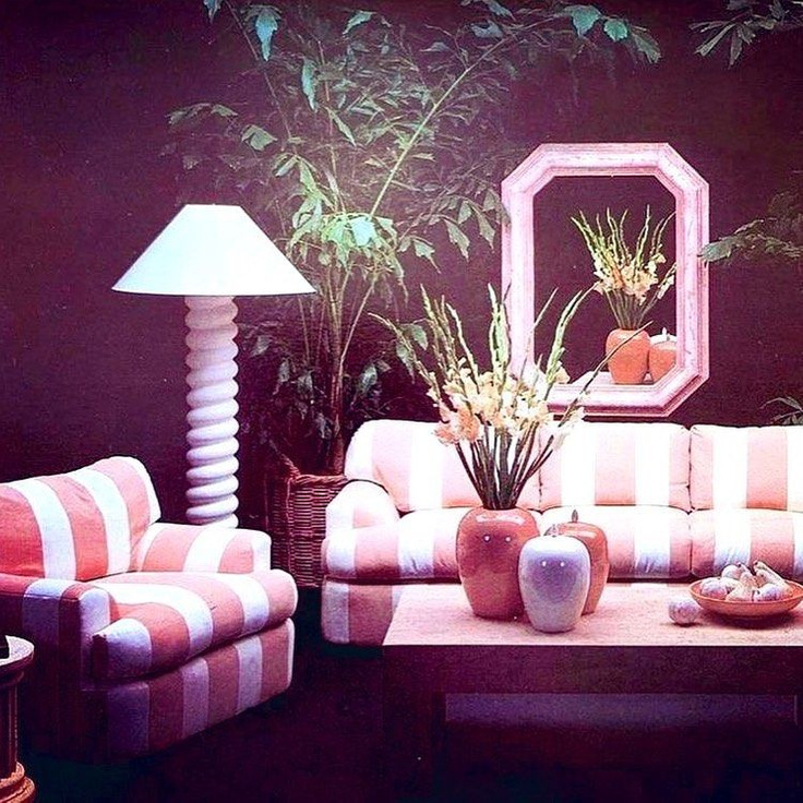 1980s decorated living room with mauve stripe sofa and chair, geometric mirror, and houseplants - @jenniferthenc_realtor