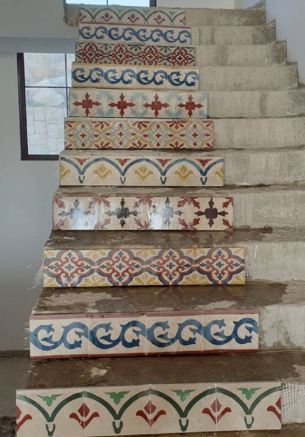 Stair risers with various encaustic tiles ascending - Art Carreaux Ciment. #encaustictiles #staircase