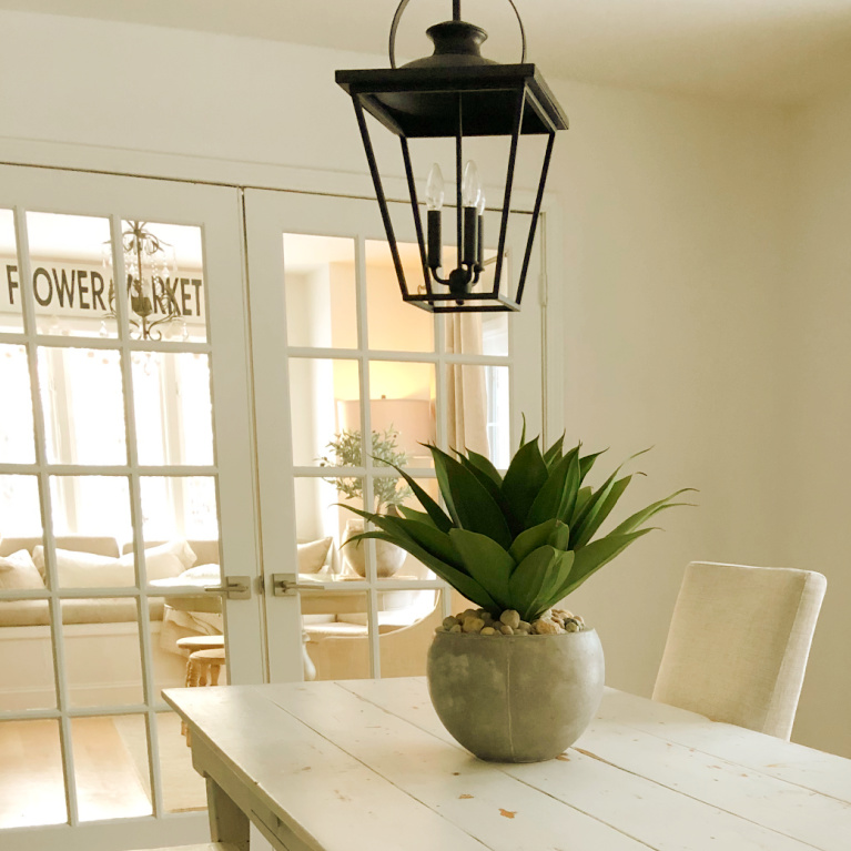 Simple spare and natural dining room with farm table and 24" artificial agave potted succulent- Hello Lovely Studio.