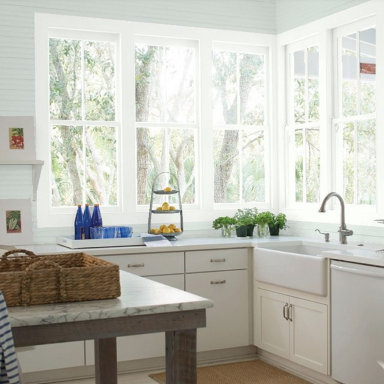 Modern farmhouse kitchen painted Quiet Moments (Benjamin Moore) with white cabinets painted Chantilly Lace. #quietmoments #paintcolors #chantillylace #kitchen #paleblue