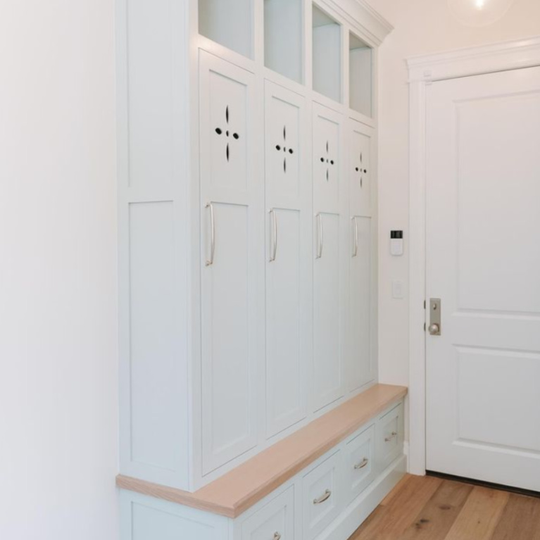 Quiet Moments pale blue pant color (Benjamin Moore) on mud room custom wood cabinet lockers - @prestigewoodworks. #quietmoments #quietmoments #palebluepaint #paintcolors