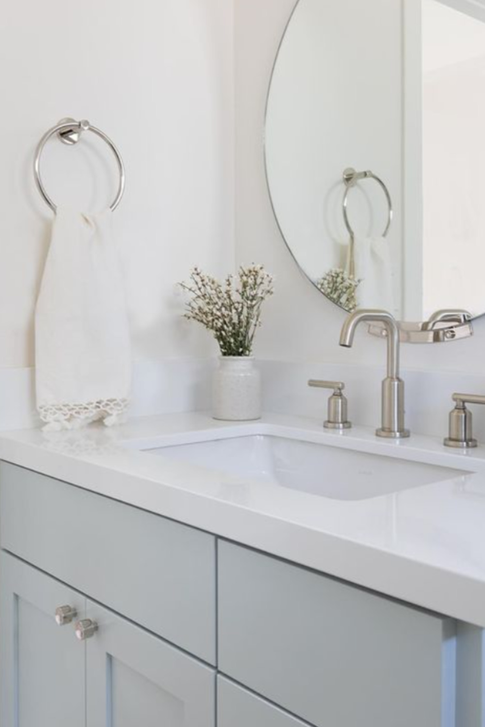 Light blue bathroom vanity painted Quiet Moments (Benjamin Moore) - @evalarocqueinteriors. #quietmoments #paintcolors #vanity #bluebathroom