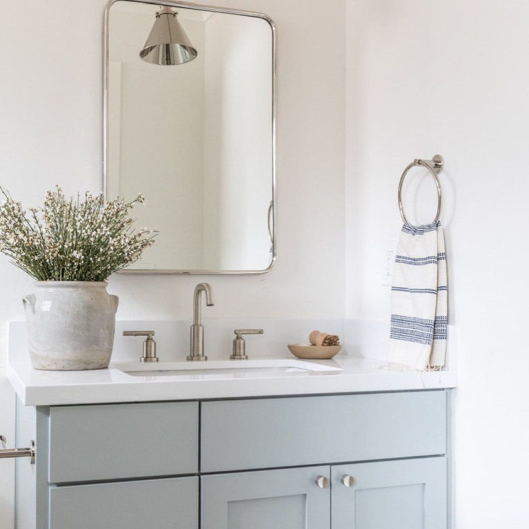 Light blue bathroom vanity painted Quiet Moments (Benjamin Moore) - @evalarocqueinteriors. #quietmoments #paintcolors #vanity #bluebathroom