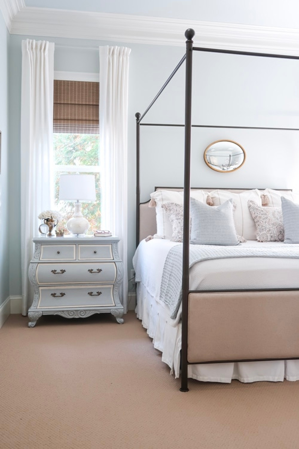 Pale blue bedroom walls painted Quiet Moments (Benjamin Moore) with poster bed and French nightstand - Porchdaydreamer. #quietmoments #benjaminmoorequietmoments #paleblue #bluebedroom