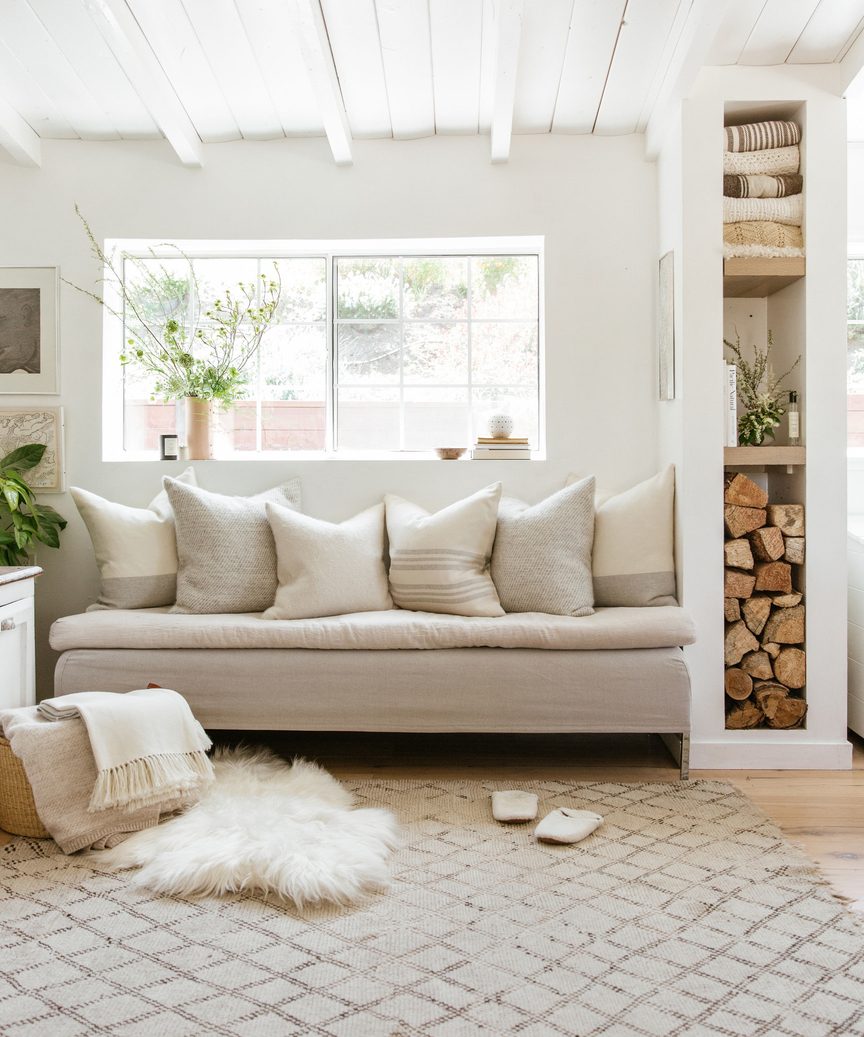 Jenni Kayne arctic sheepskin in a gorgeous natural rustic luxe space with built-in.