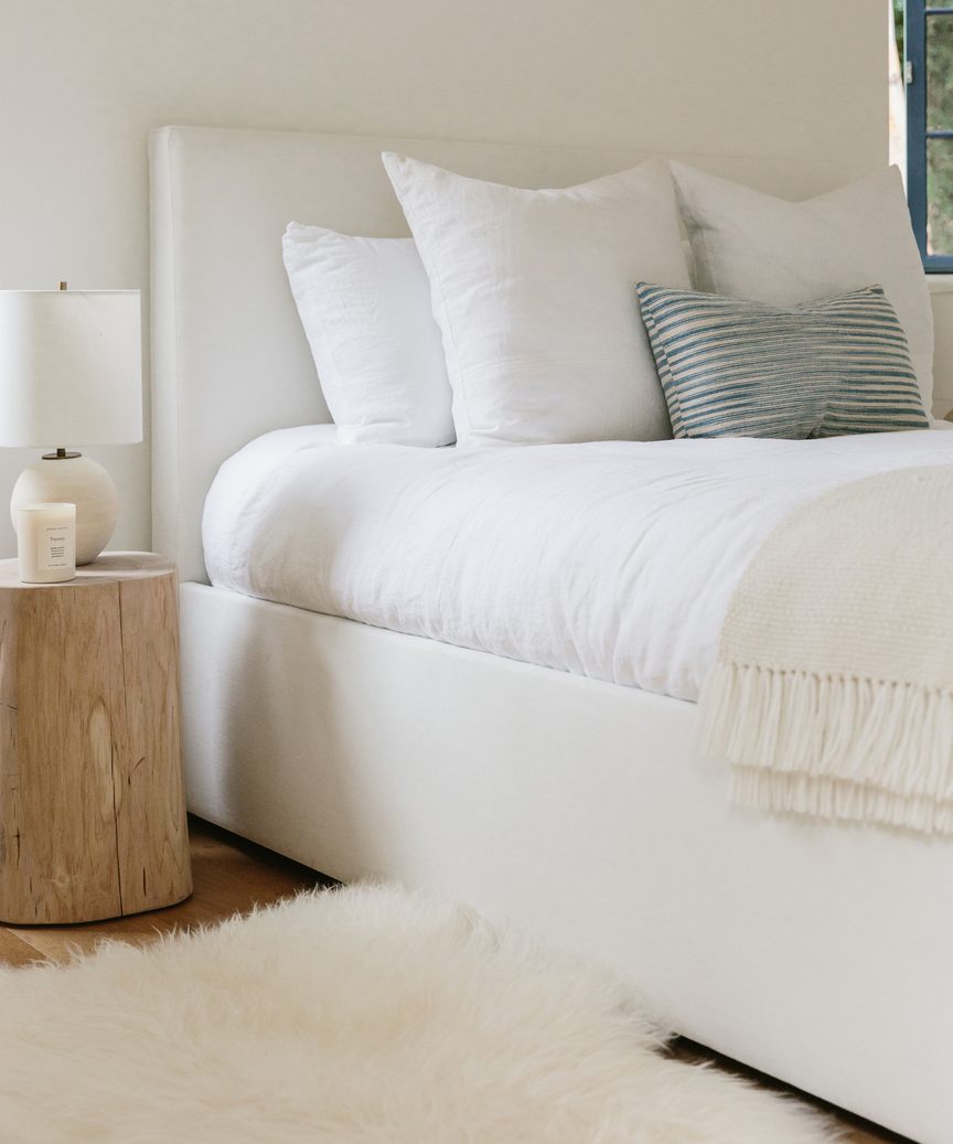 Natural, quiet, subdued mood in a lovely Jenni Kayne bedroom with white bedding and linens.