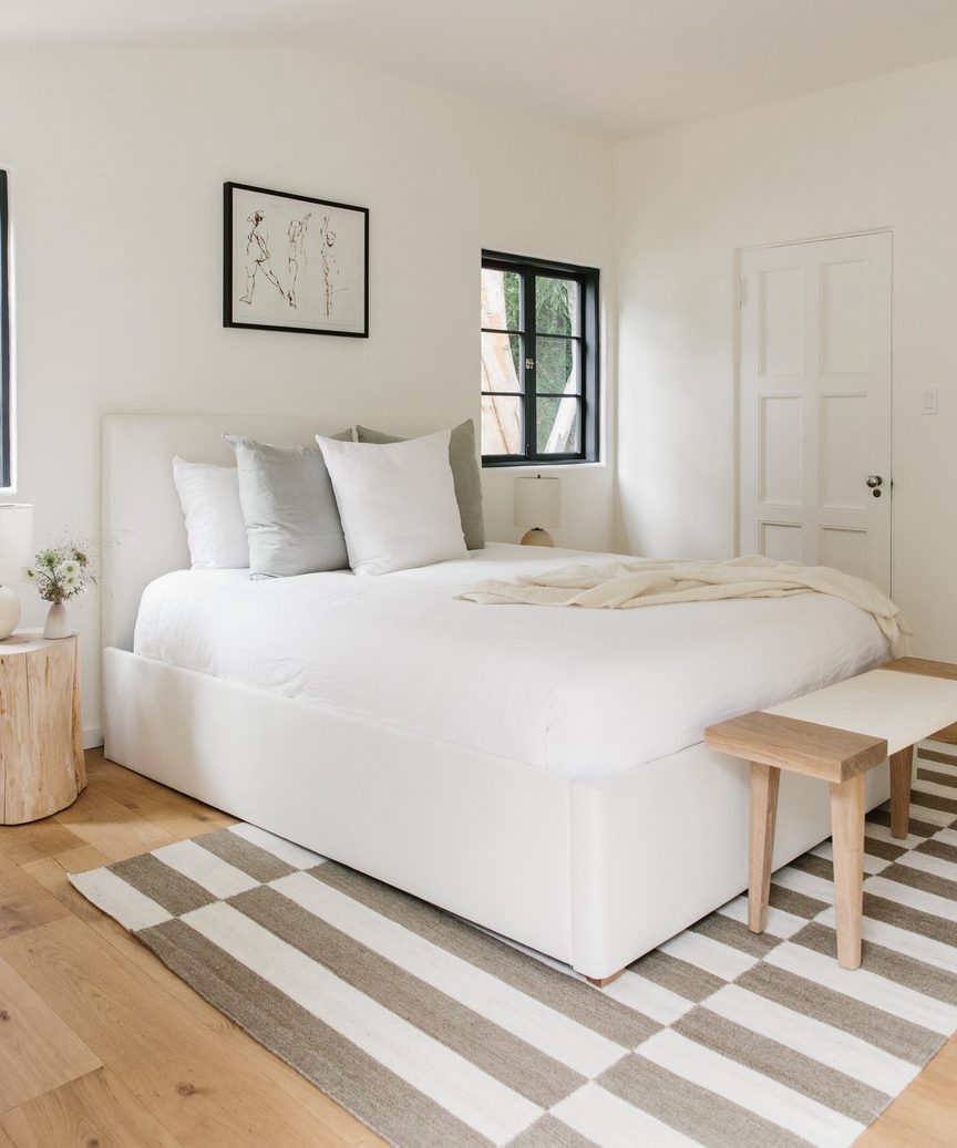 Bold stripe rub in an otherwise understated, minimal, modern, natural luxe bedroom - Jenni Kayne.