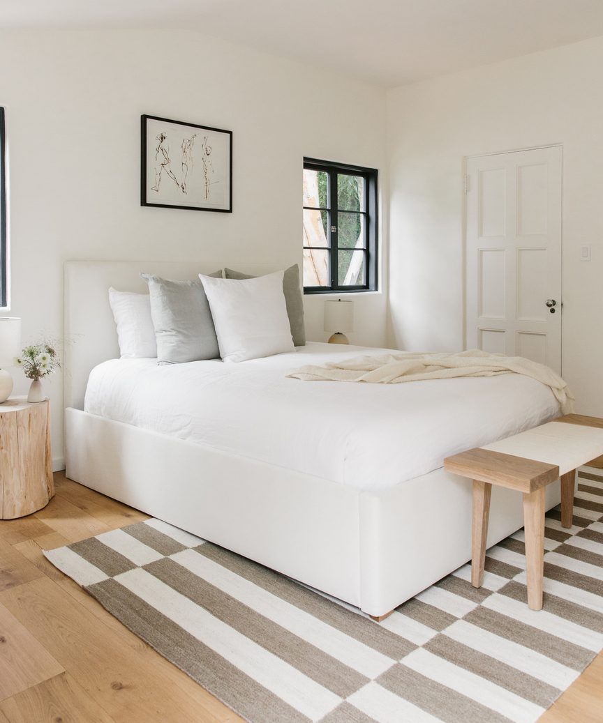 Natural, quiet, subdued mood in a lovely Jenni Kayne bedroom with stripe rug and minimal design.