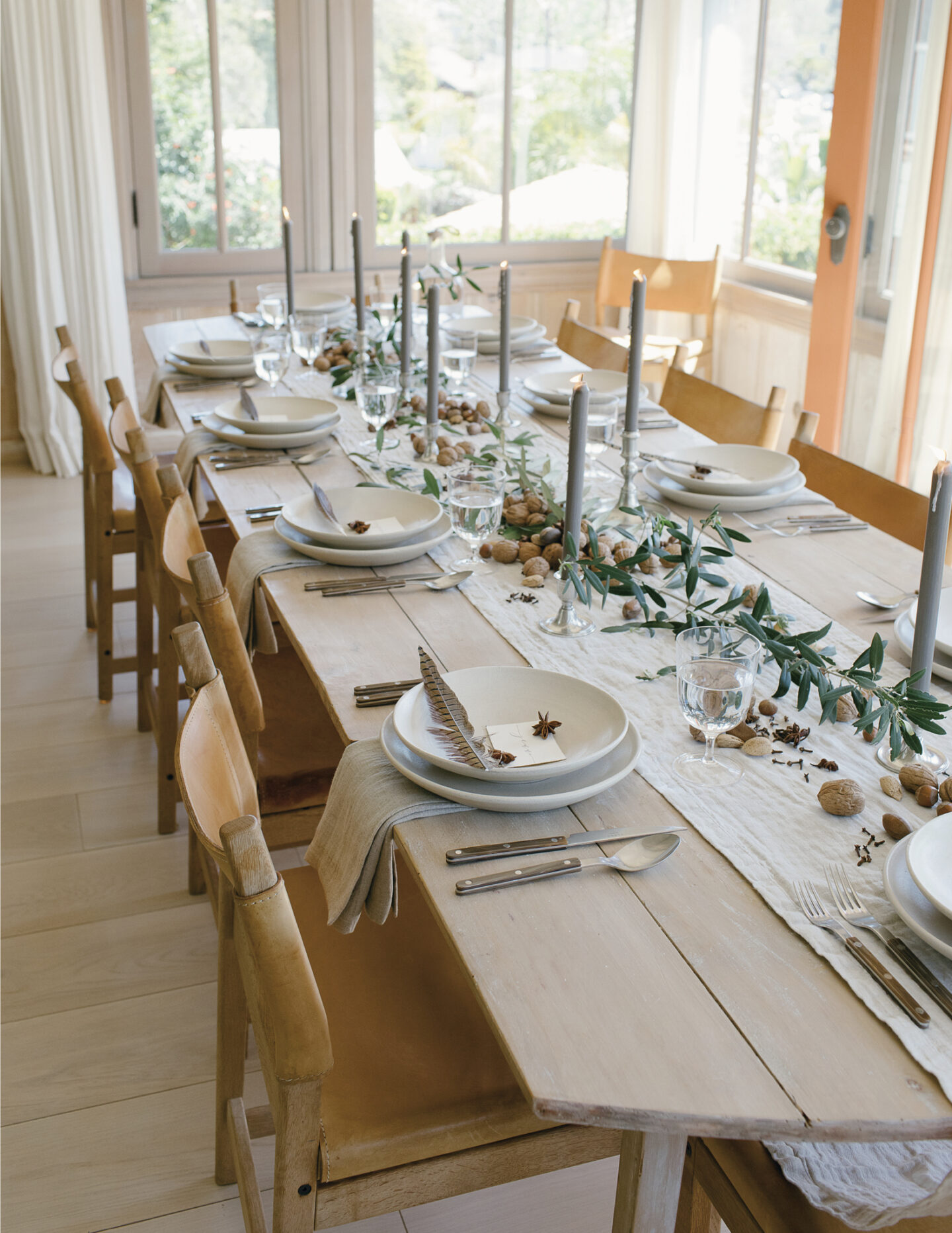 Simplicity and nature are celebrated in this Jenni Kayne tablesape with gray candles in PACIFIC NATURAL (Rizzoli, 2019).