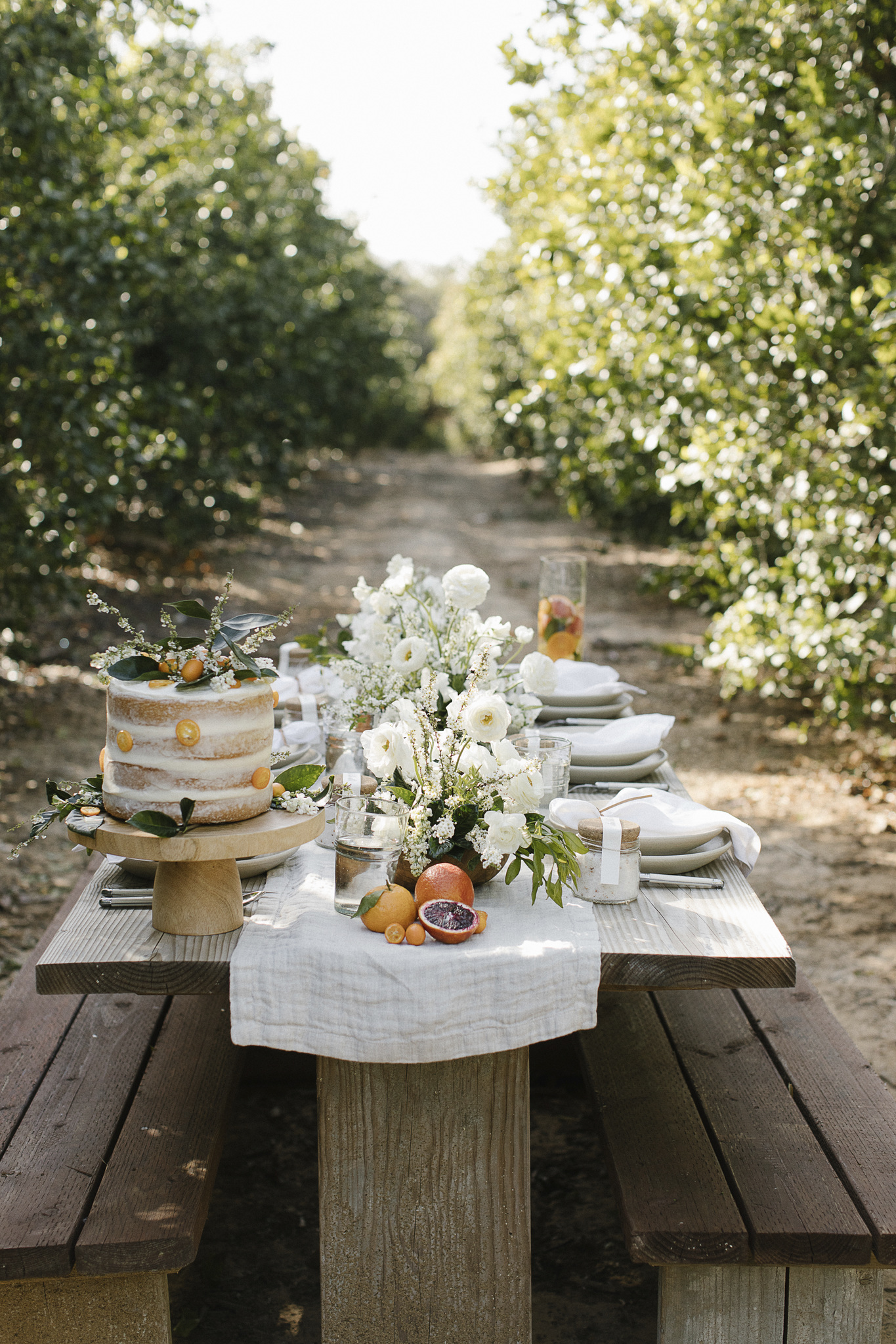 Outdoor dining tablescape with organic, earthy, Jenni Kayne style - in PACIFIC NATURAL (Rizzoli, 2019).