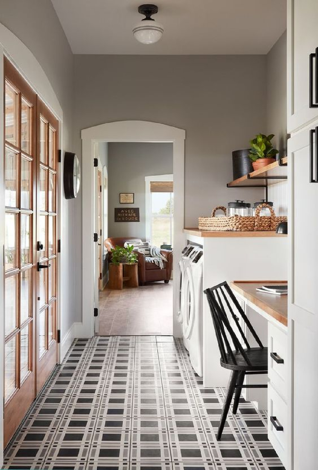 Plaid encaustic floor tile pattern in a lovely laundry room by Joanna Gaines on Fixer Upper. #plaidfloor