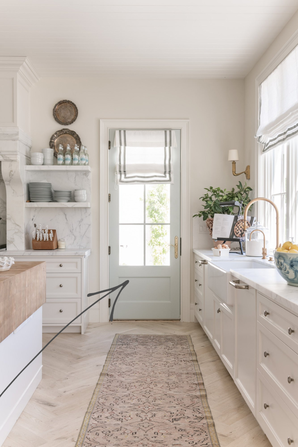 Quiet Moments (BM) paint color on a kitchen glass door - Rachel Parcell. #lightblue #bluegrey #paintcolors