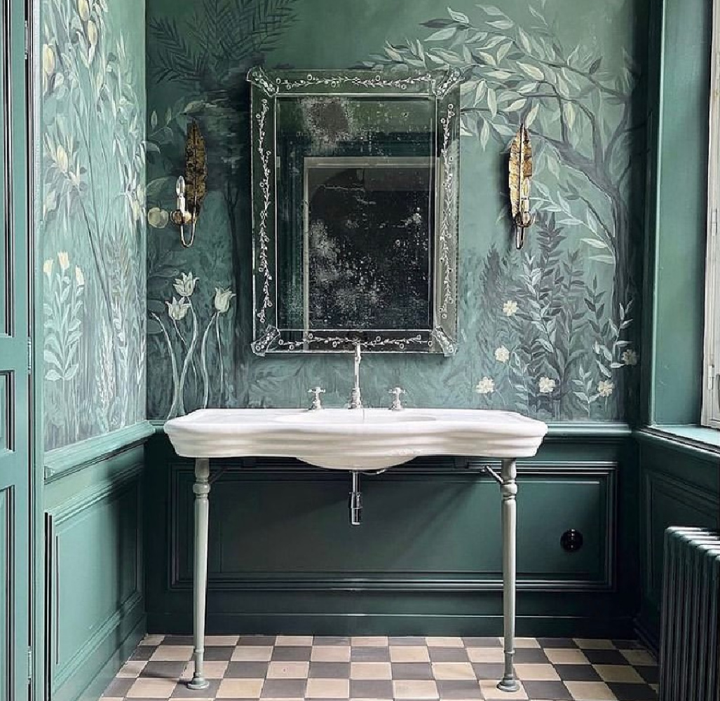 Beautiful deep green bath with handpainted mural, console sink, and encaustic tile floor in French chateau - @le_fleur_honfleur. #greenbathrooms #muralinbath #encaustictile