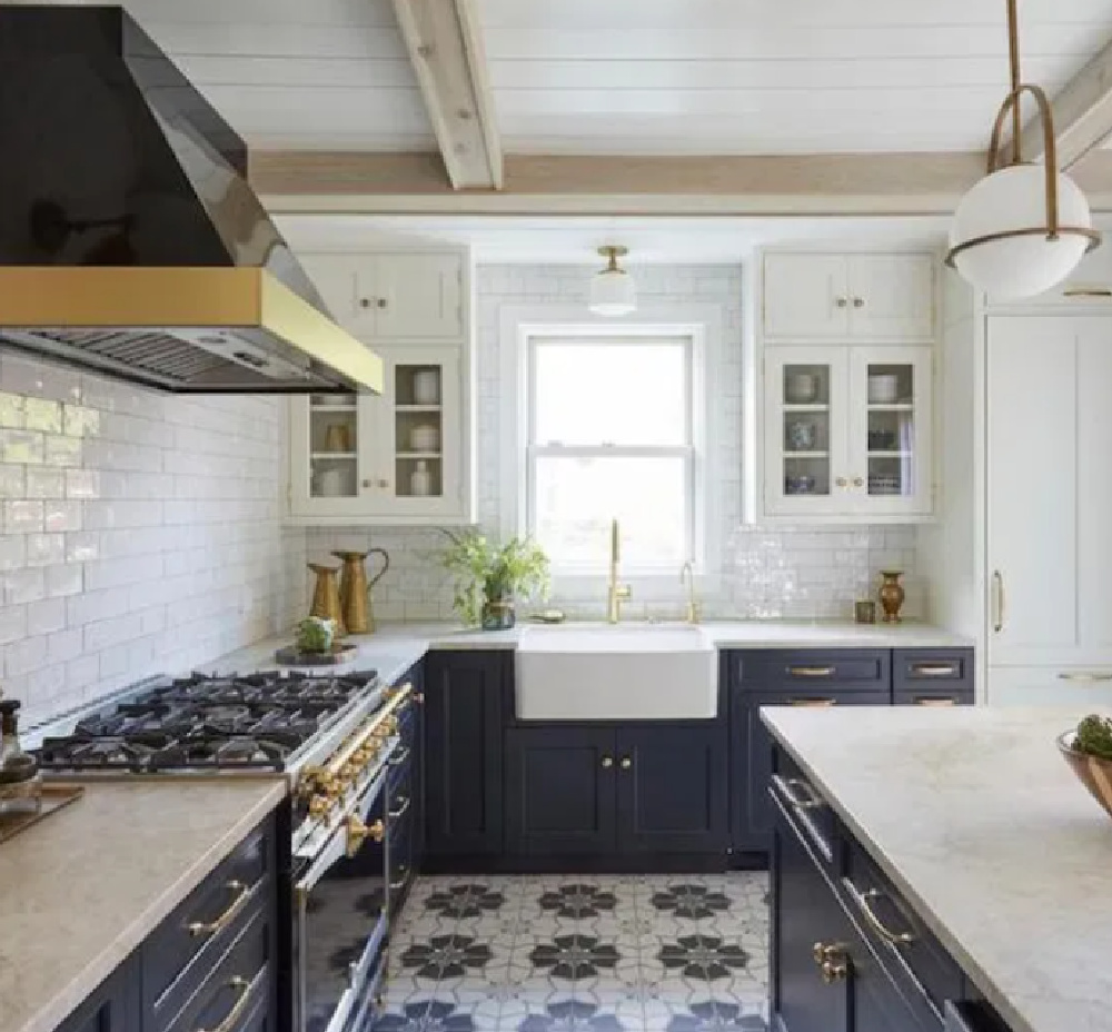 Navy blue kitchen with cement tile floor, subway tile, and midcentury modern pendant. Come see 36 Best Beautiful Blue and White Kitchens to Love! #blueandwhite #bluekitchen #kitchendesign #kitchendecor #decorinspiration #modernfarmhousekitchen