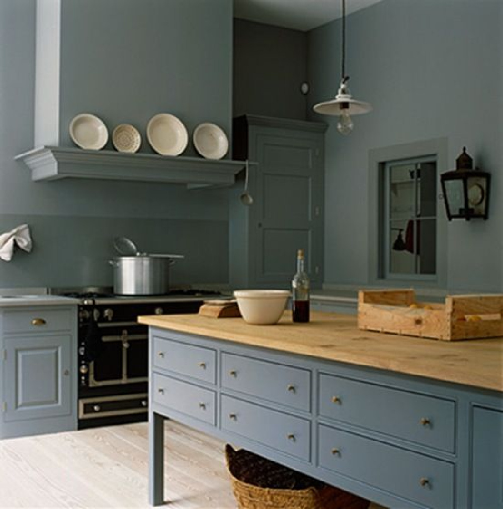 Gorgeous and serene blue grey monochromatic English country kitchen by Plain English with bespoke cabinetry and luxurious black range. #englishcountry #kitchendesign #greykitchen #bluegray #bluegrey