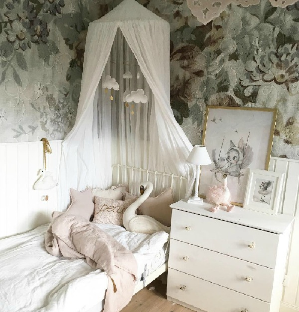 Serene and ethereal little girl's bedroom with bold floral wallpaper and hushed palette - Villa Jenal. #bedroomdesign #girlsbedroom #romanticbedroom #frenchnordic