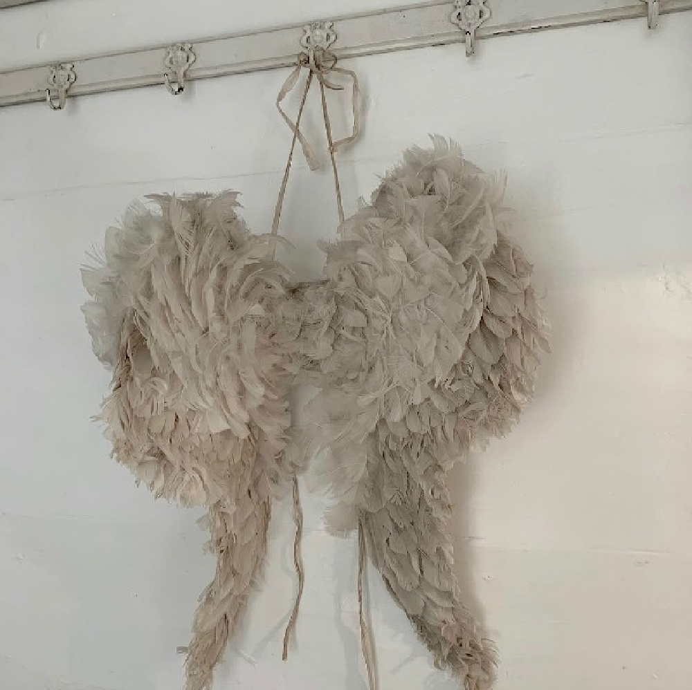 Beautiful vintage feathery wings hang from a peg rack and imparts French Nordic style - Cathrine Aust. #angelwings #frenchnordic #nordicfrench #scandinaviandecor