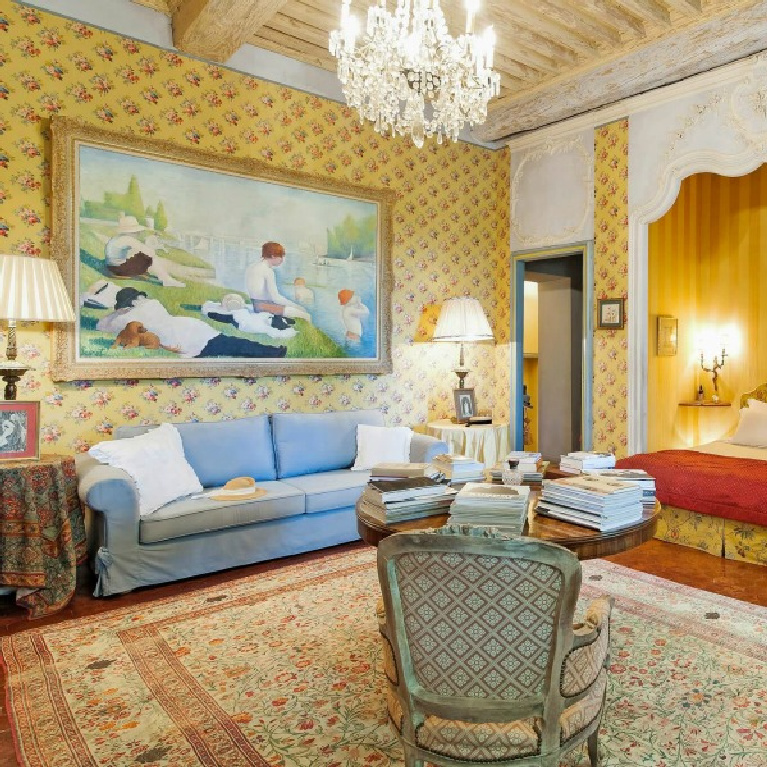 Bright and cheerful traditional style French country colors of blue and yellow in a stunning bedroom with crystal chandelier in a Provence chateau - Haven In.