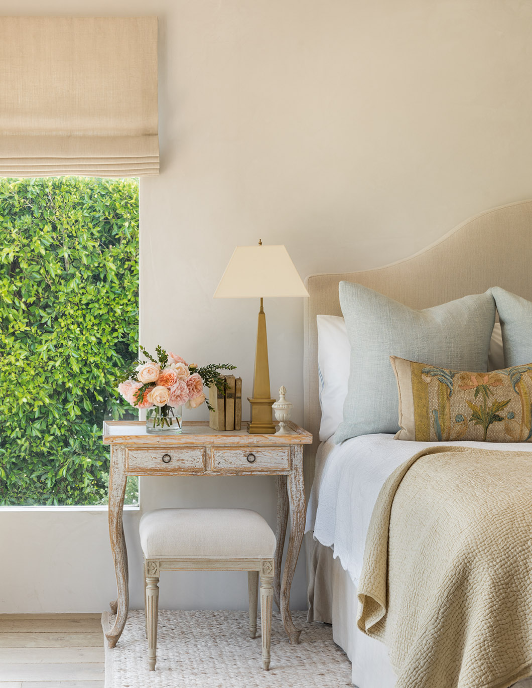 Sumptuous linen headboard, European antiques, and sophisticated European inspired design from Brooke Giannetti in a bedroom from PATINA HOMES. #bedroomdecor #europeancountry #interiordesign #brookegiannetti