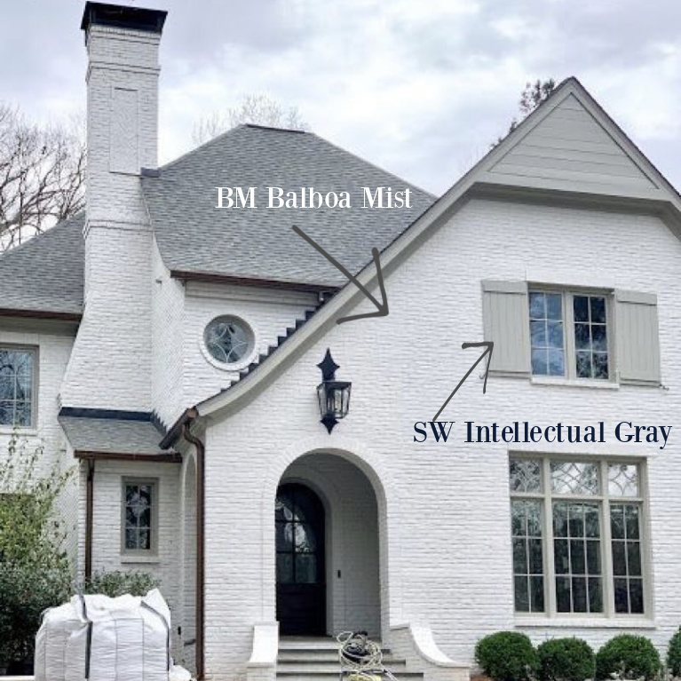 Balboa Mis (Benjamin Moore) paint color on brick exterior of house and Sherwin-Williams Intellectual Gray on trim and shutters. #paintcolors #balboamist #intellectualgray