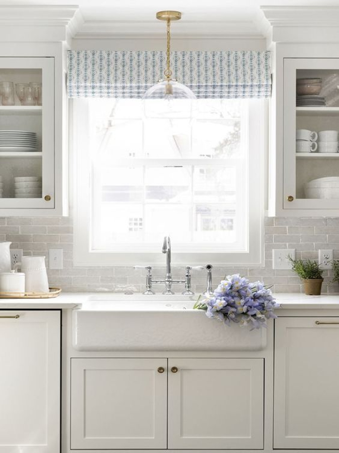 Blue and white kitchen with farm sink designed by Bria Hammel. #blueandwhite #kitchendesign