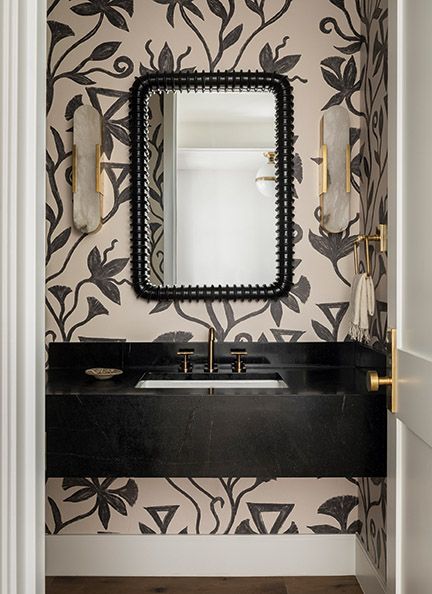 Lovely black graphic wallpaper in a bathroom with design by Brian Paquette.