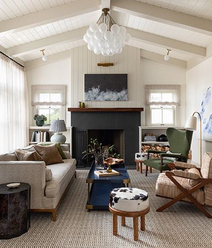 Beautiful black fireplace in a classic living room by Brian Paquette - featured in the book AT HOME (Gibbs Smith, 2021) with phogoraphy by Haris Kenjar.