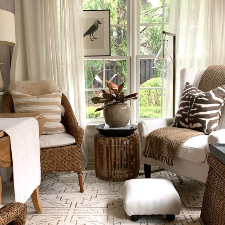 Keeping room with lovely woven chairs and neutrals - Sherry Hart.