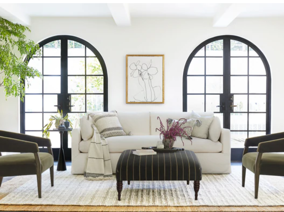 Black and white living room with arched French doors and Myla sofa from Lulu & Georgia.